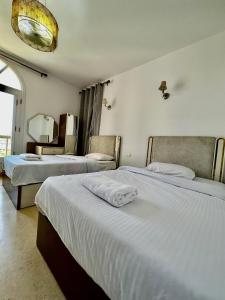 A bed or beds in a room at New Marina MP 37