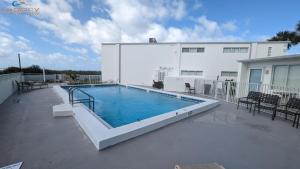 a swimming pool on top of a building at IS9-Cozy Upstairs Beachfront Condo - King Beds in Fort Walton Beach