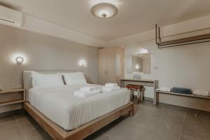 Postel nebo postele na pokoji v ubytování ALS COMFORT SUITES + 37 fotografií