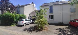 a white car parked in front of a house at Maison et jardin Nantes Chantenay in Nantes