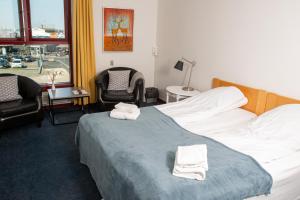 Postel nebo postele na pokoji v ubytování Hotel Hundested