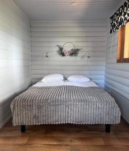Postel nebo postele na pokoji v ubytování Jauri Resort