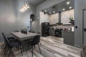 a kitchen and dining room with a table and chairs at The Urban Bourbon. Sip and Savor in Louisville +23 photos