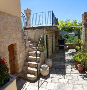 a stone staircase leading up to a house at Tre sorelle in Lastovo