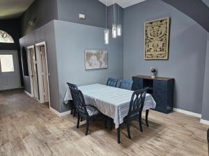 a dining room with a table and chairs at Mufasa's Pride in Kissimmee