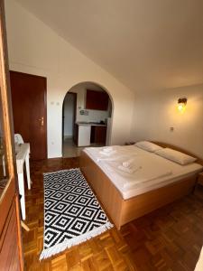 Katil atau katil-katil dalam bilik di Apartmani palma