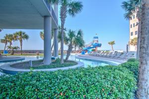 a water park at the beach with a slide at The Oasis At Orange Beach 2215 by Liquid Life in Orange Beach