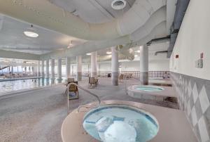 a hot tub in the middle of a building at The Oasis At Orange Beach 2215 by Liquid Life in Orange Beach