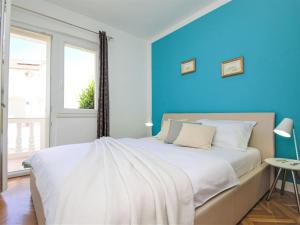 Postel nebo postele na pokoji v ubytování Apartment Aquanur-7 by Interhome