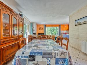 a dining room with a table and some chairs at Holiday Home Tina by Interhome in Naujac-sur-Mer +20 photos