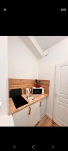 a kitchen with a counter with a microwave on it at Appartement vue mer in Calais +18 photos