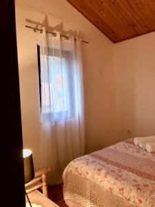 a bedroom with a bed and a window at Apartment Aida in Karlobag