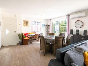 a living room with a table and chairs at Holiday Home Carraou by Interhome in Vielle-Saint-Girons