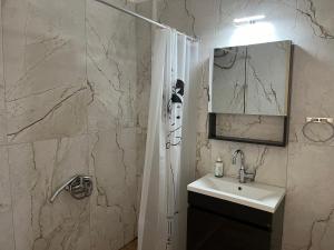 Kúpeľňa v ubytovaní Xronis apartments + 16 fotografií