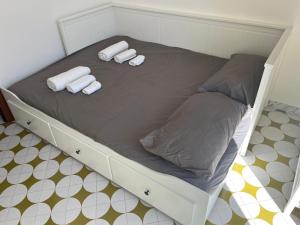 A bed or beds in a room at Villa Bianca, Seaside panoramic Rooftop