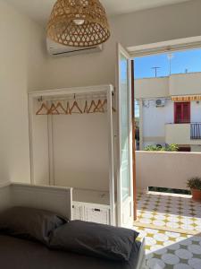 A bed or beds in a room at Villa Bianca, Seaside panoramic Rooftop