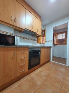 Kuchyň nebo kuchyňský kout v ubytování Apartamento San Agustín Playa
