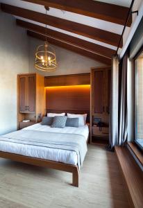 Łóżko lub łóżka w pokoju w obiekcie Magna Pivot