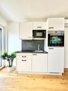 Kuchyň nebo kuchyňský kout v ubytování Wohnung mit Balkon