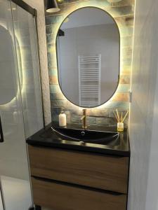 a bathroom with a sink and a mirror at El Sueño de Luca, Parking gratuito centro in Logroño +19 photos
