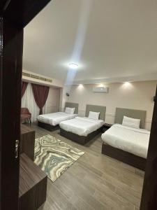 Voodi või voodid majutusasutuse Aziz Egypt Pyramids Hotel toas