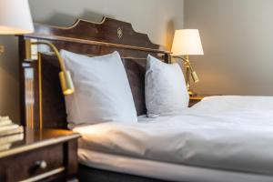 Voodi või voodid majutusasutuse Hotel Royal toas