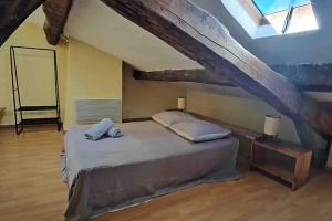Postel nebo postele na pokoji v ubytování Maison Puylaurentaise