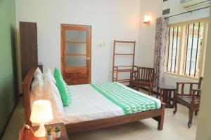 En eller flere senge i et værelse på Destine Holiday Bungalow