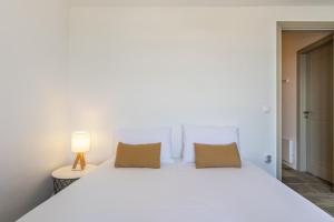 Posteľ alebo postele v izbe v ubytovaní Avra House Kythnos