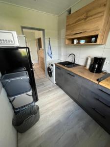 a kitchen with a sink and a stove at Ferienwohnung - Monteurwohnung Büren in Büren