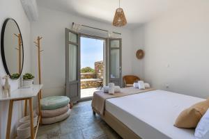 Posteľ alebo postele v izbe v ubytovaní Avra House Kythnos