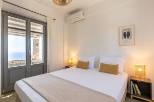 Posteľ alebo postele v izbe v ubytovaní Avra House Kythnos