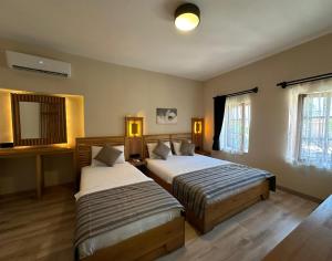 Кровать или кровати в номере Bodrum Konağı