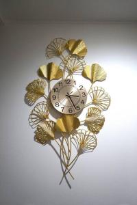 a clock in the shape of a flower on a wall at Private Hotel Asakusa in Tokyo +52 photos