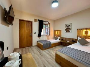 Кровать или кровати в номере Bodrum Konağı