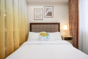 Postel nebo postele na pokoji v ubytování LD Cozy Condo Unit - BE Residences near Cebu IT Park
