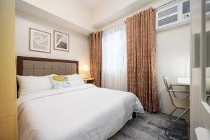 Postel nebo postele na pokoji v ubytování LD Cozy Condo Unit - BE Residences near Cebu IT Park