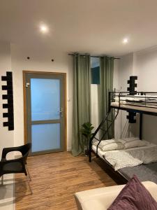Ένα ή περισσότερα κρεβάτια σε δωμάτιο στο Apartament Gold 3
