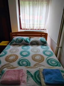 Ένα ή περισσότερα κρεβάτια σε δωμάτιο στο Apartman Ana