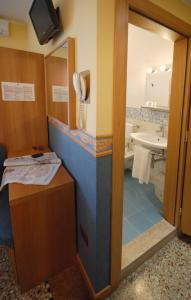 a bathroom with a sink and a mirror at Antica Villa Graziella in Marghera