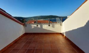 a view from the balcony of a house at Ático Alefriz in Fisterra +8 photos