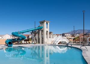 a swimming pool with a slide in front of a building at Angels Landing3bed2ba Private Hot Tub in Washington