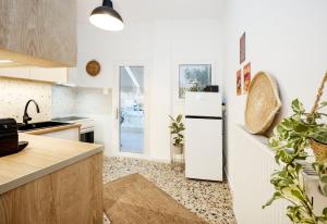 a kitchen with a refrigerator and a counter top at S37 Acropolis View in Athens