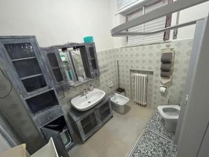 a bathroom with a sink and a toilet at Casa Giulia in Porto SantʼElpidio +24 photos