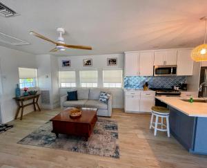 a kitchen and living room with a couch and a table at Kings Kamp in Key Largo