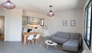 a living room with a couch and a table at Argolis Stone Homes in Kranidi