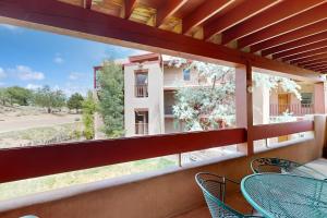 a balcony with a table and chairs and a building at Ciclo Grande 202B in Santa Fe