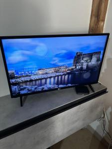 A television and/or entertainment centre at Azzurra Apartment