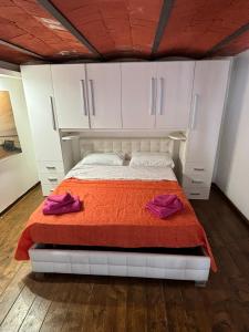A bed or beds in a room at Azzurra Apartment