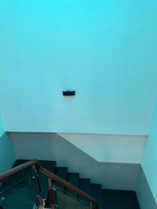 a set of stairs with a blue light at Tien Dat Motel in Pleiku